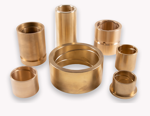 Precision-machined bronze bushings with oil and grease grooves for lubrication.