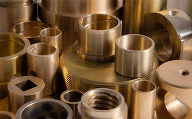 Various types of bronze bushings including standard, custom machined, and sintered bushings from Diversified Bronze.