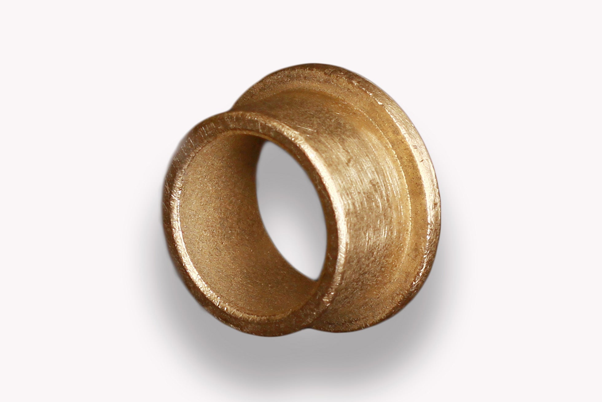 Sintered bronze flanged bushings that are oil impregnated and are self-lubricating.